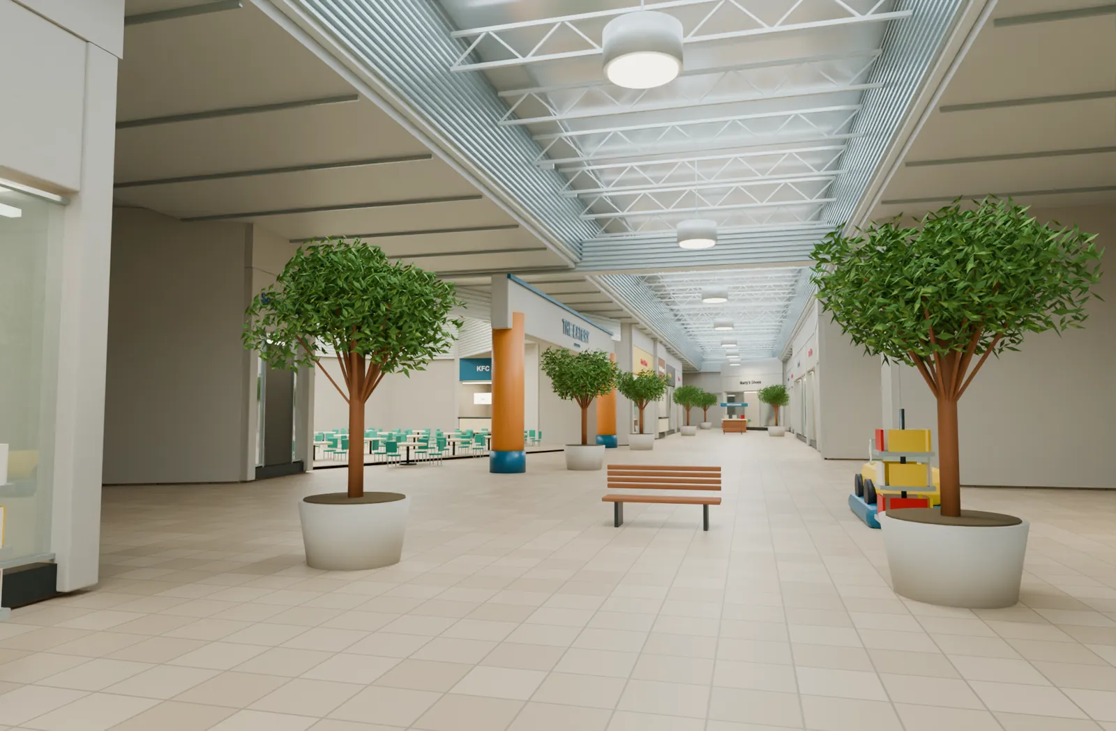 The mall concourse with planted trees, benches and a skylit ribbed soffit